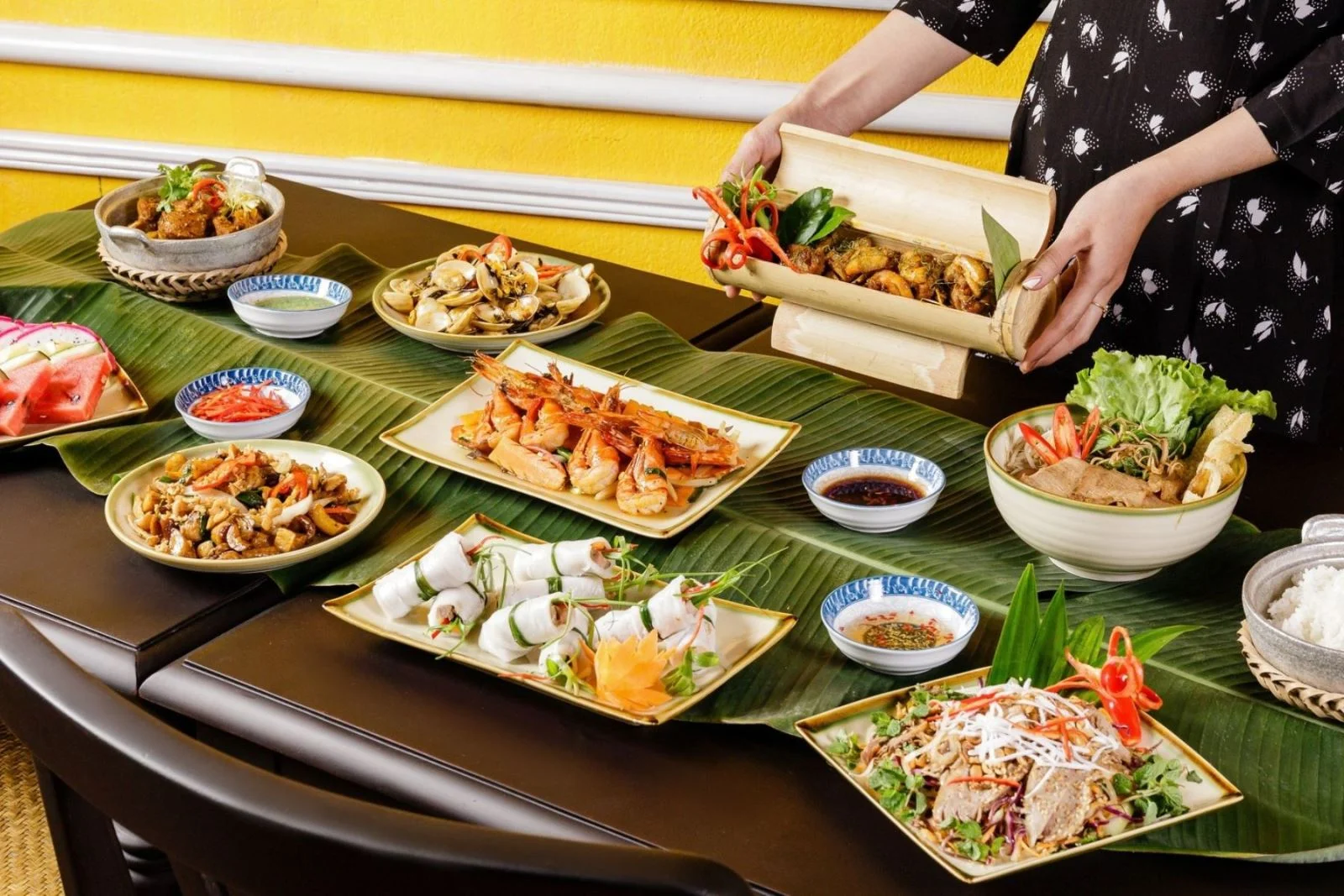 A delicious spread of home-cooked Vietnamese dishes served at a local house in the hoi an handicraft tours.