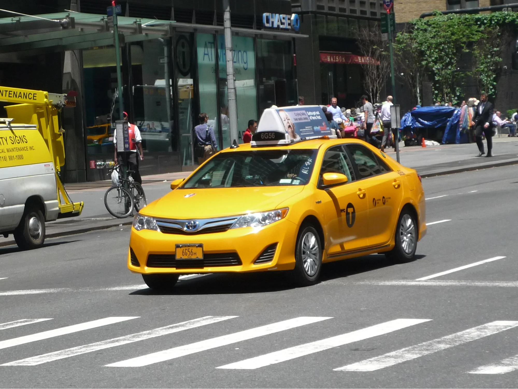 yellow taxi cab for hire in the city street ready for a transfer to Thanh Ha Pottery Village