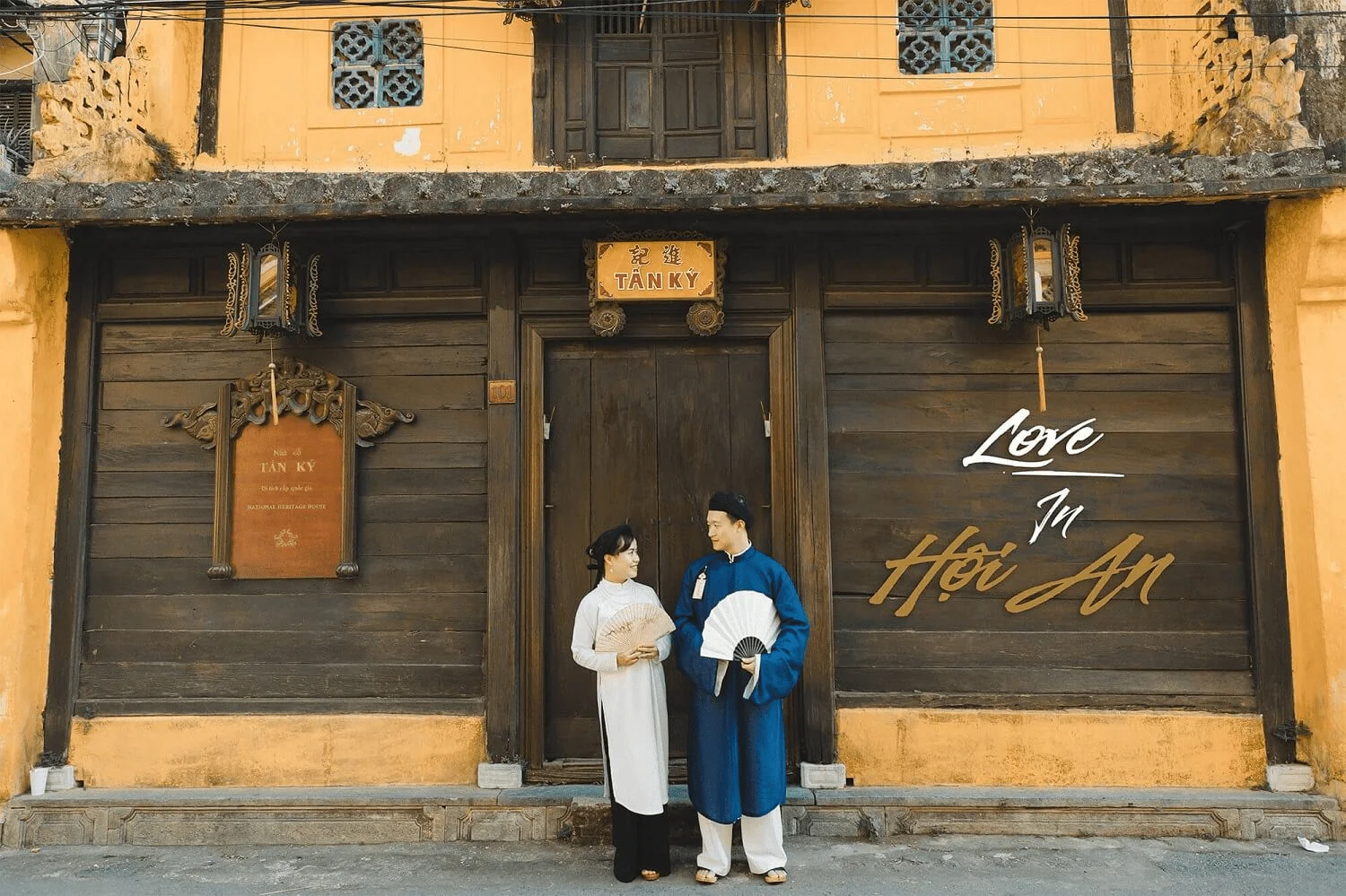 Couple in traditional attire at Tan Ky Ancient House in Hoi An