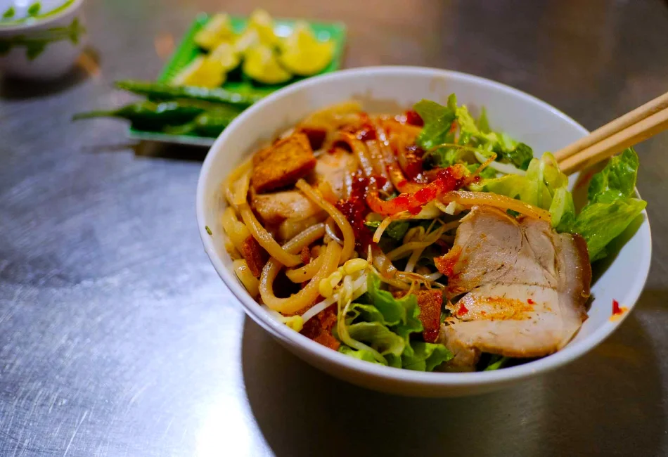 Enjoying a bowl of noodles at Tan Ky Old House history in Hoi An