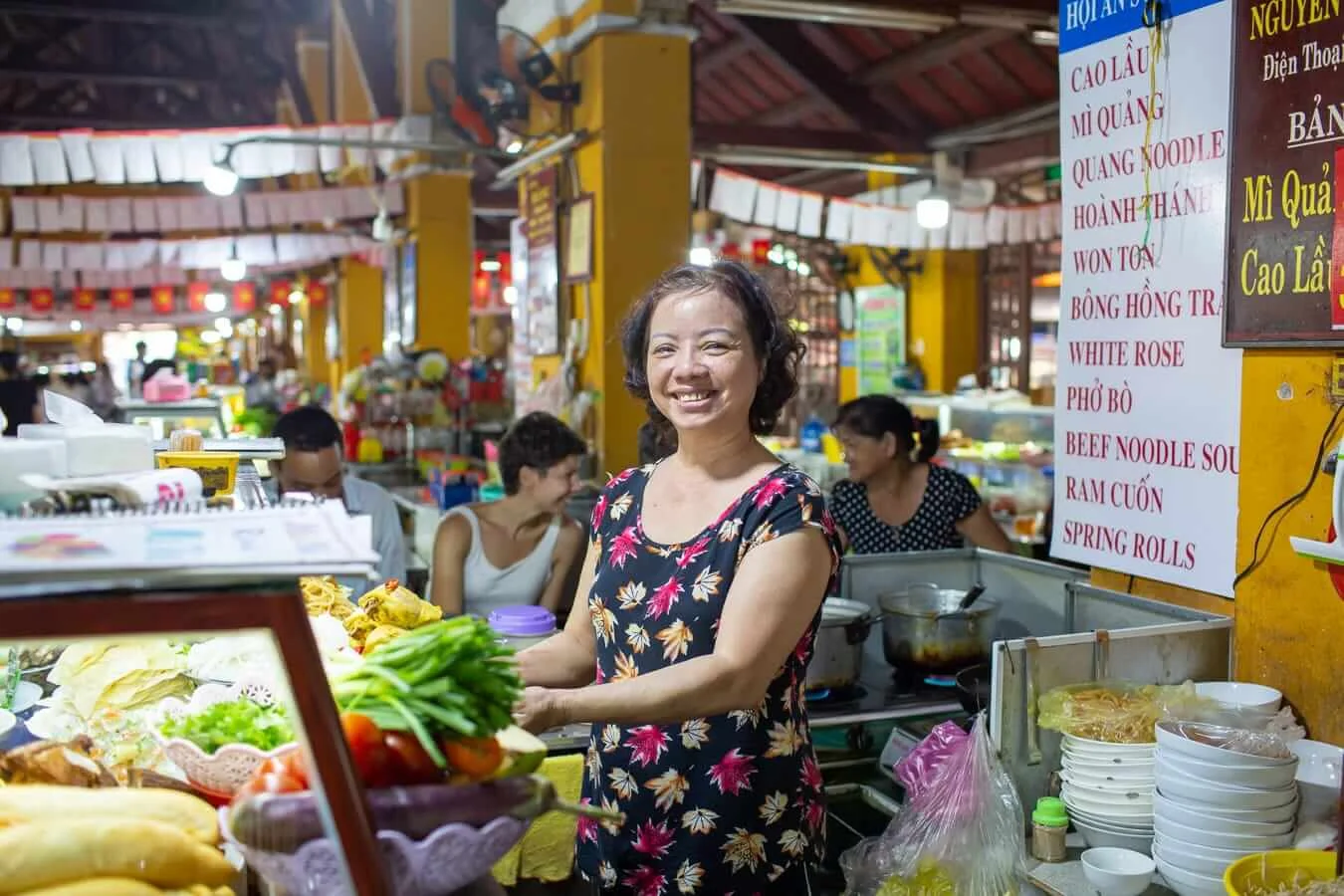 Woman serving food at the Hoi An Central Market food court