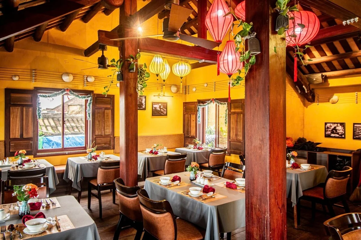 A charming restaurant interior in Hoi An, perfect for a meal before or after seeing the Bamboo Circus Hoi An.