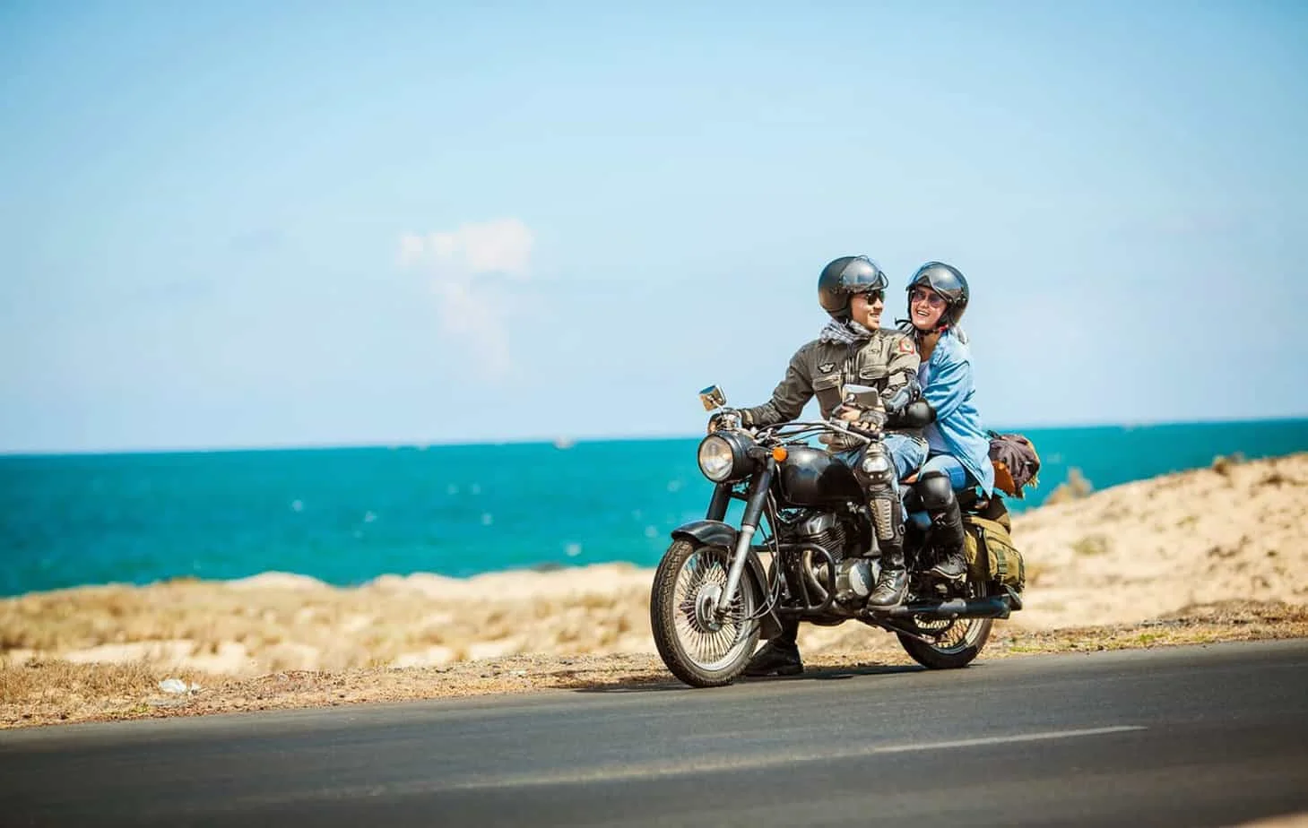 Couple on a motorbike exploring the coast near Tra Que Vegetable Village