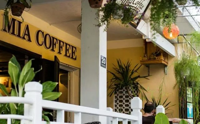 Mia Coffee Hoi An cafe exterior with plants and signage