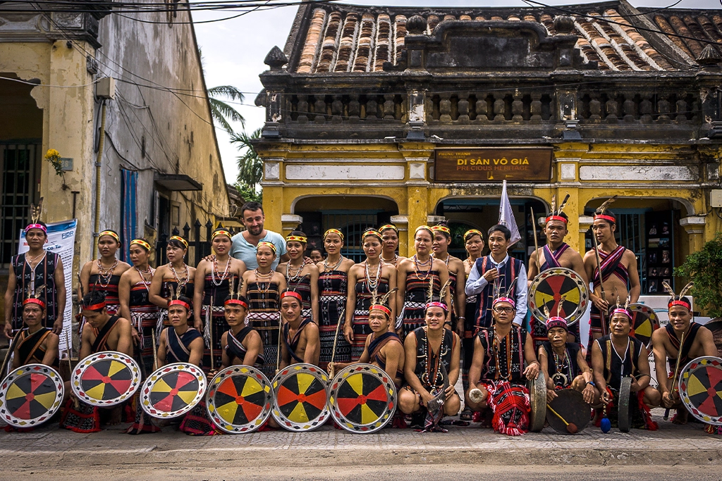 réhahn poses with members of ethnic tribes in traditional costumes outside the Precious Heritage Art Gallery Museum in Hoi An.