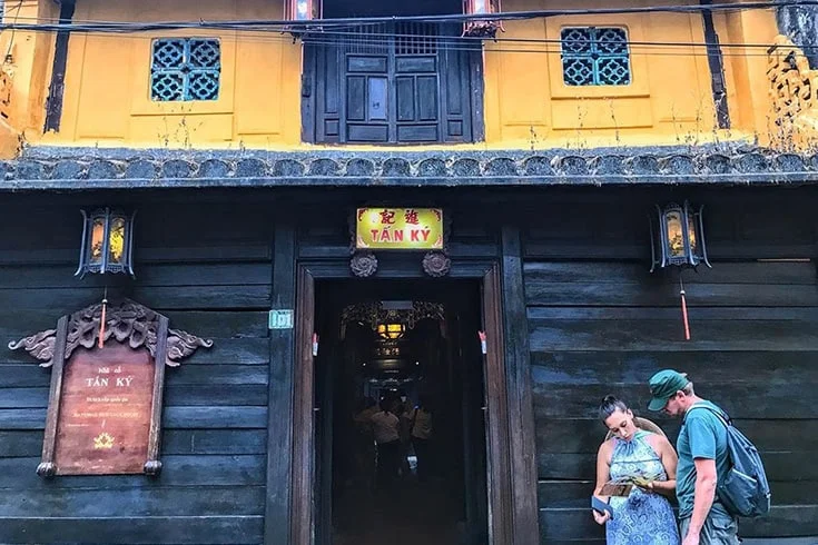 The facade of Tan Ky Ancient House with visitors