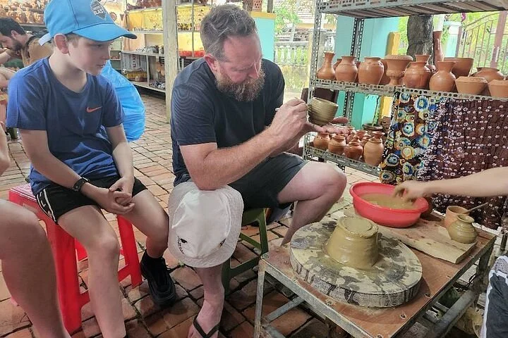 man participating in a pottery class, in Thanh Ha Pottery Village, Hoi An