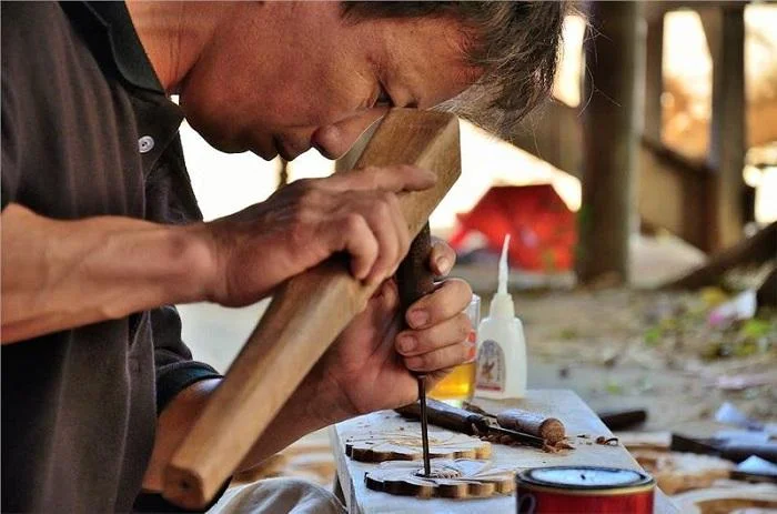 Wood carving artisan at Kim Bong Carpentry Village on the map of Hoi An Ancient Town