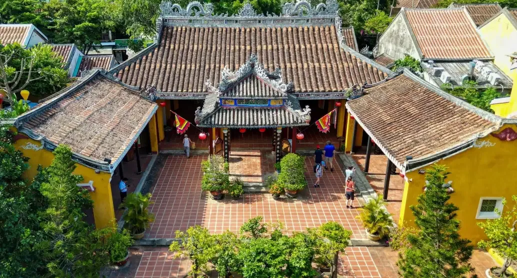 Aerial view of the traditional tile roofs and courtyard at Cam Pho Communal House.
