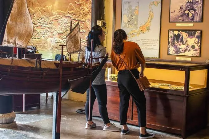Visitors examine exhibits at the Museum of Trade Ceramics.