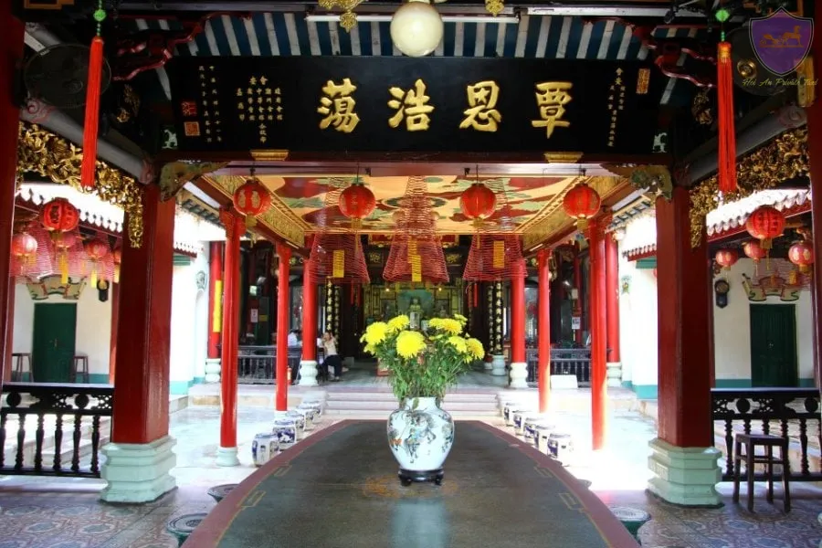 Hanging incense and red pillars at Phuc Kien Assembly Hall near Quan Am Pagoda Hoi An.