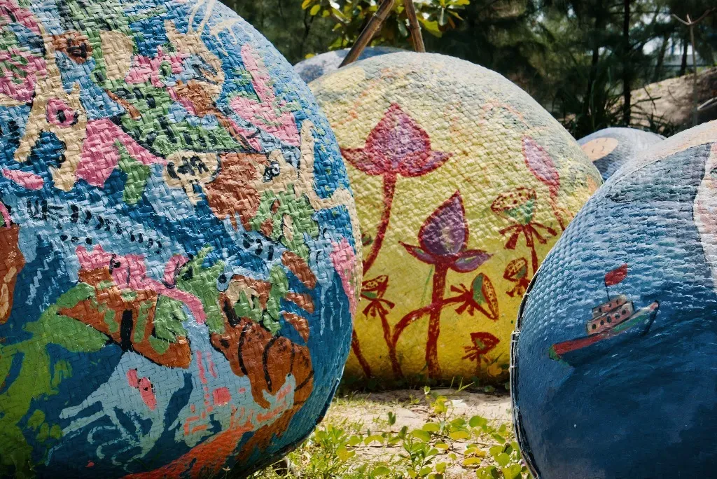 Painted coracle boats featuring lotus motifs in Tam Thanh village.