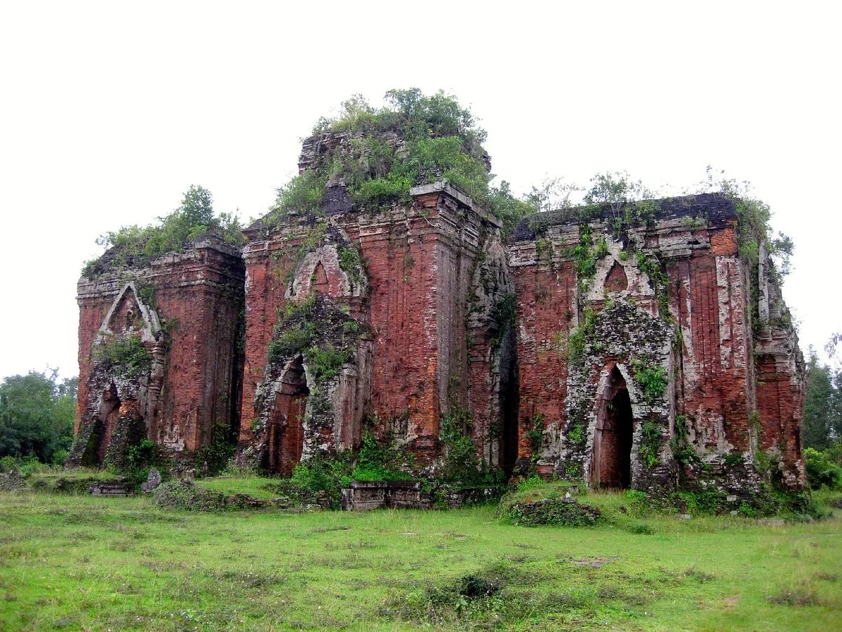 Three weathered red-brick Chien Dan Cham Towers located near Tam Thanh village.
