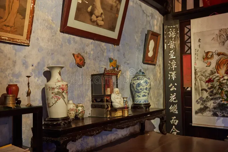 Antique vases, statues, and a tiger scroll inside the Tran Family Chapel.